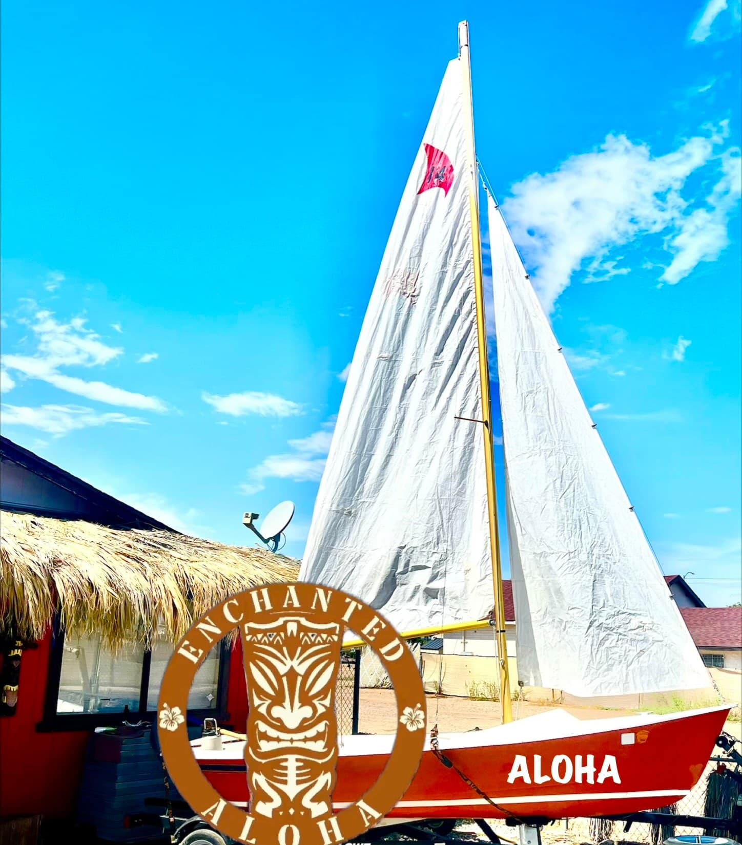 Aloha sailboat under a clear blue sky